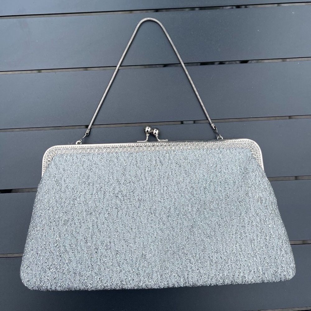 Vintage silver clutch purse. Width, from 8.5-10 inches, 5.5 inches tall.